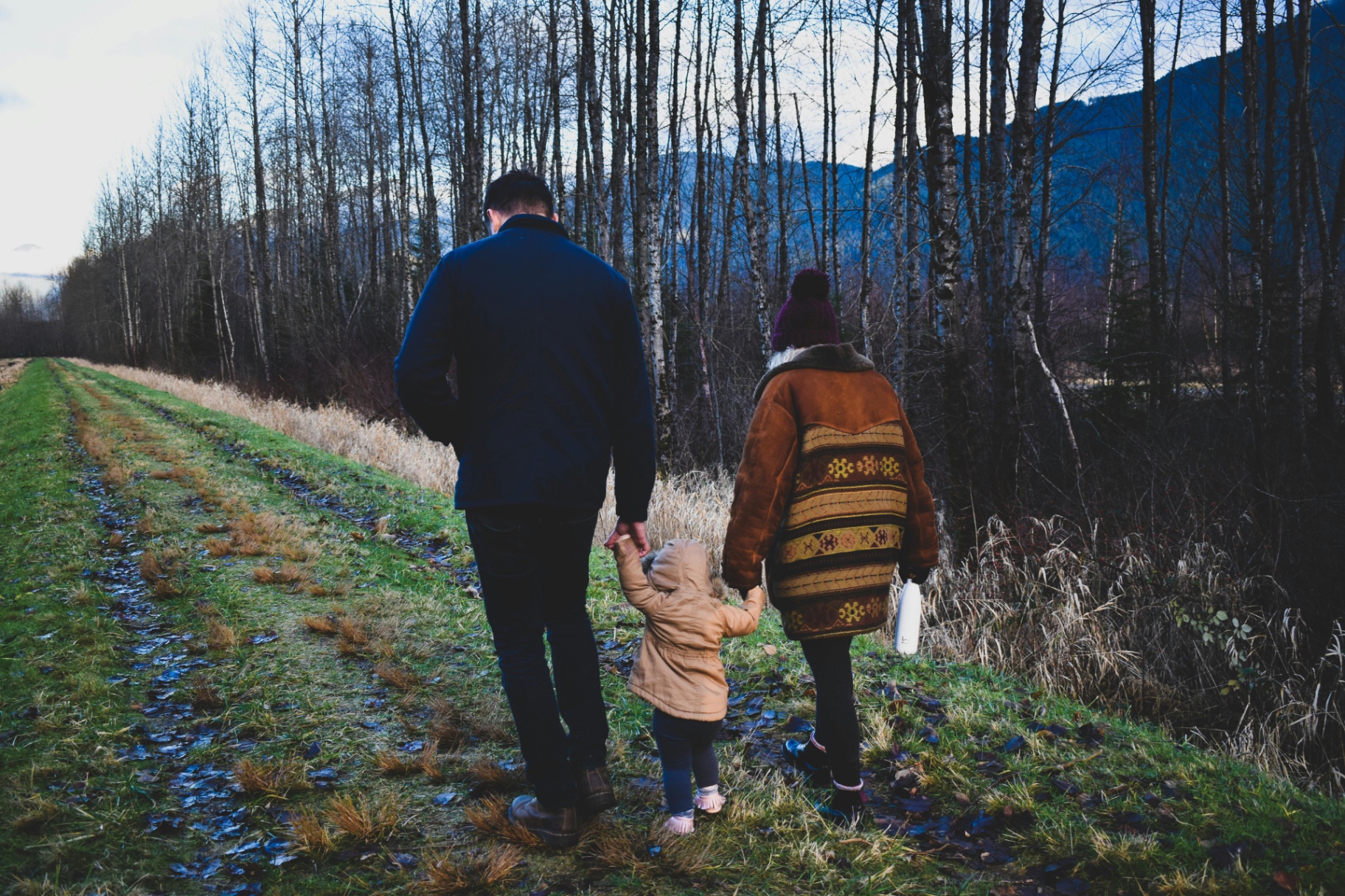Family walking in nature representing the peace of mind provided by life insurance coverage