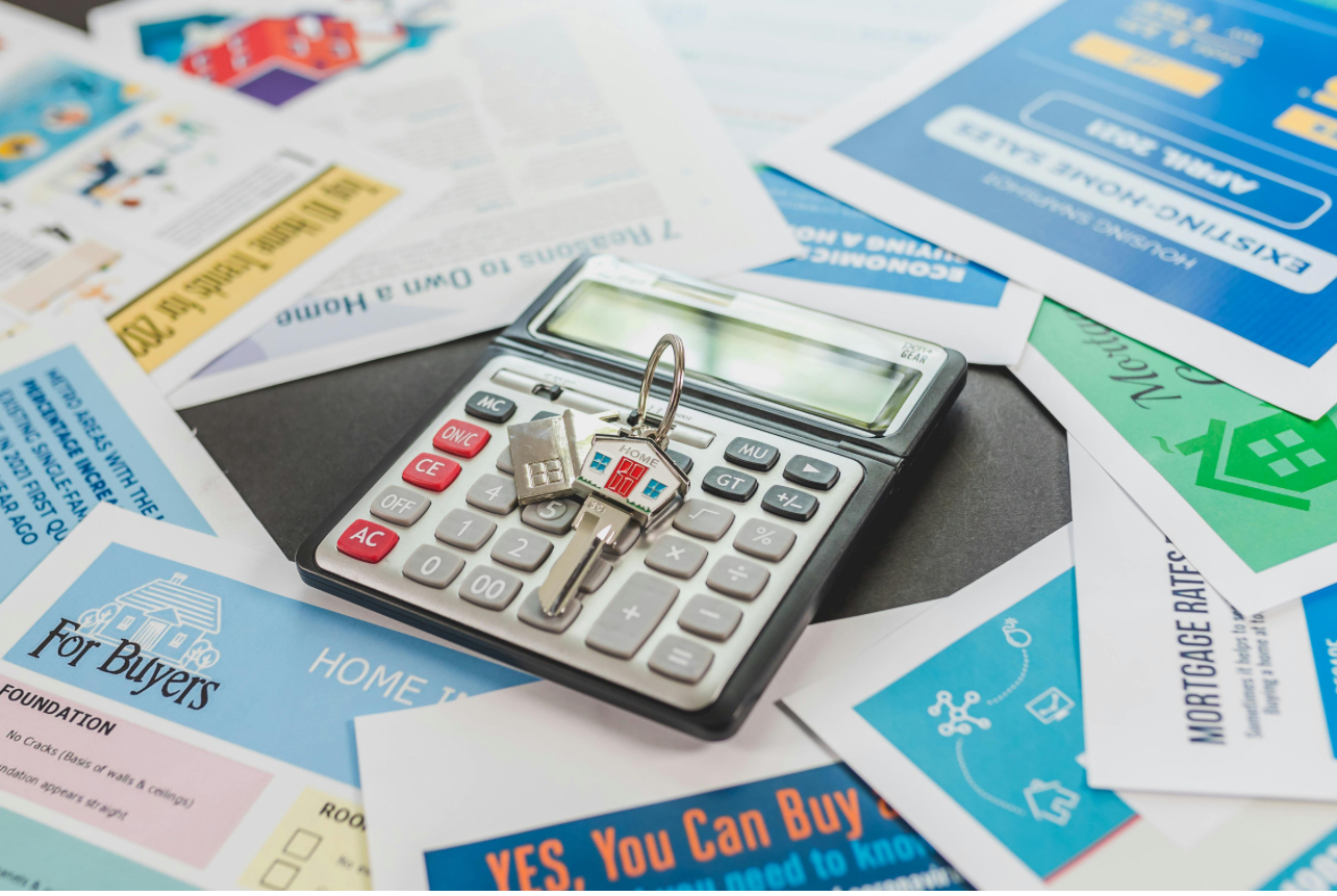 Property investment financial planning with calculator and mortgage documents
